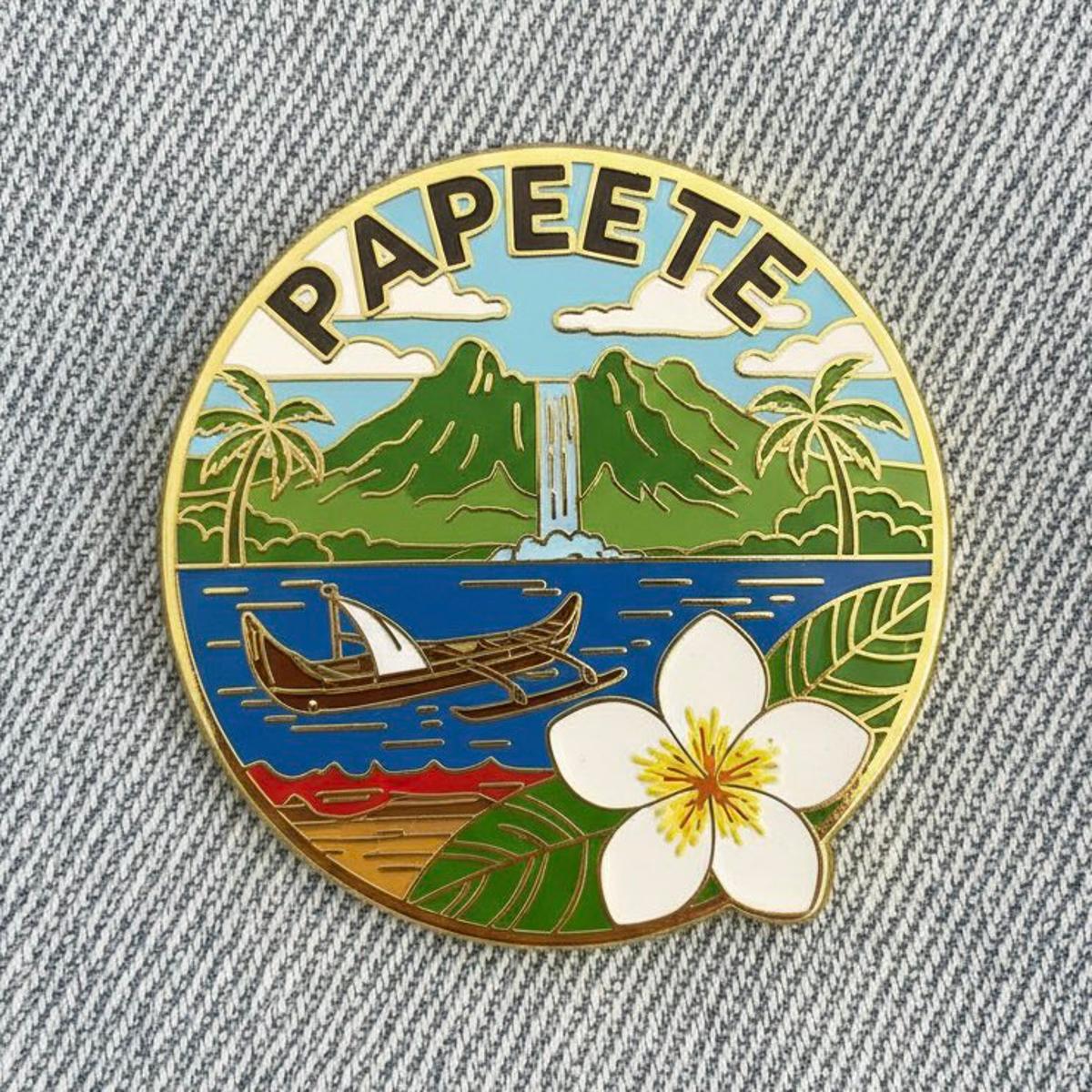 Close-up photo of a collectible enamel pin of [CITY], gold-p