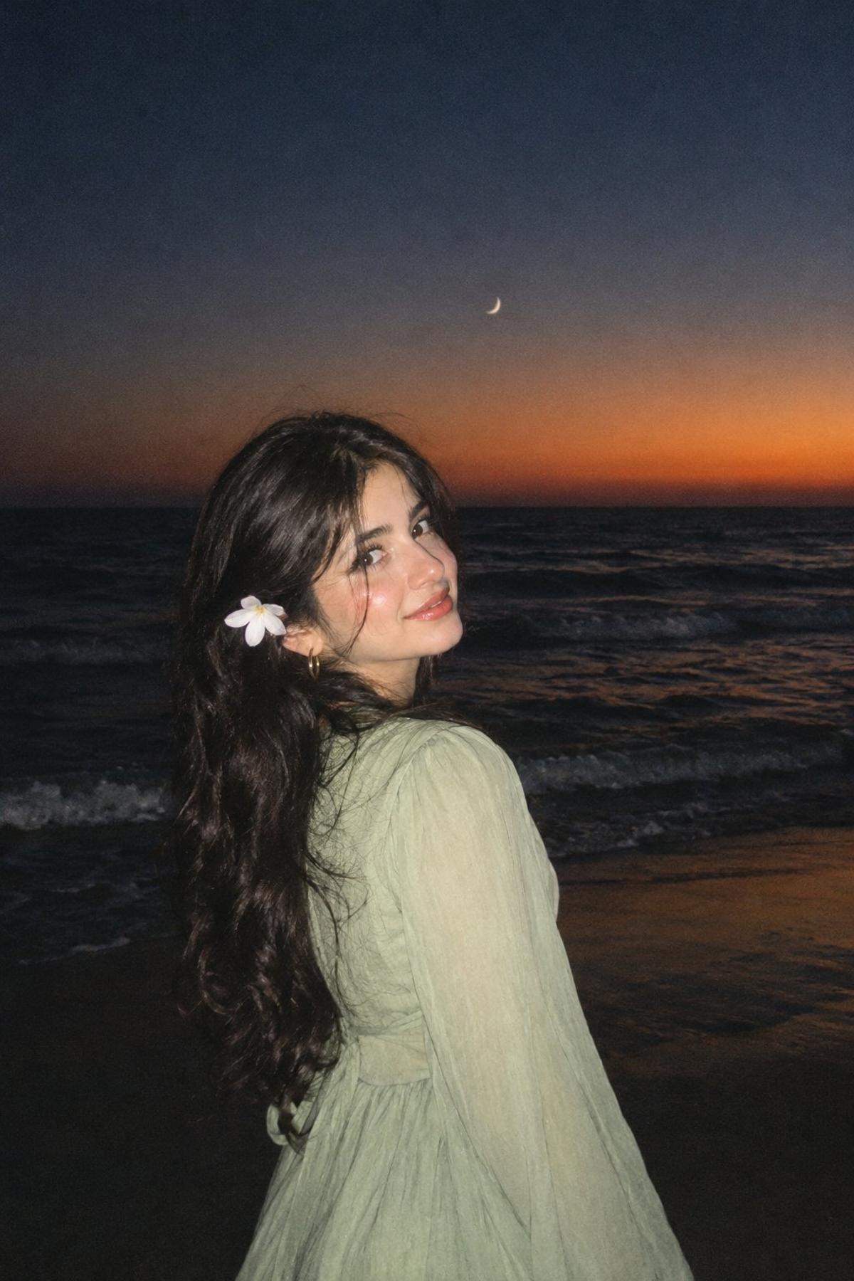 Twilight beach flash portrait with a crescent moon