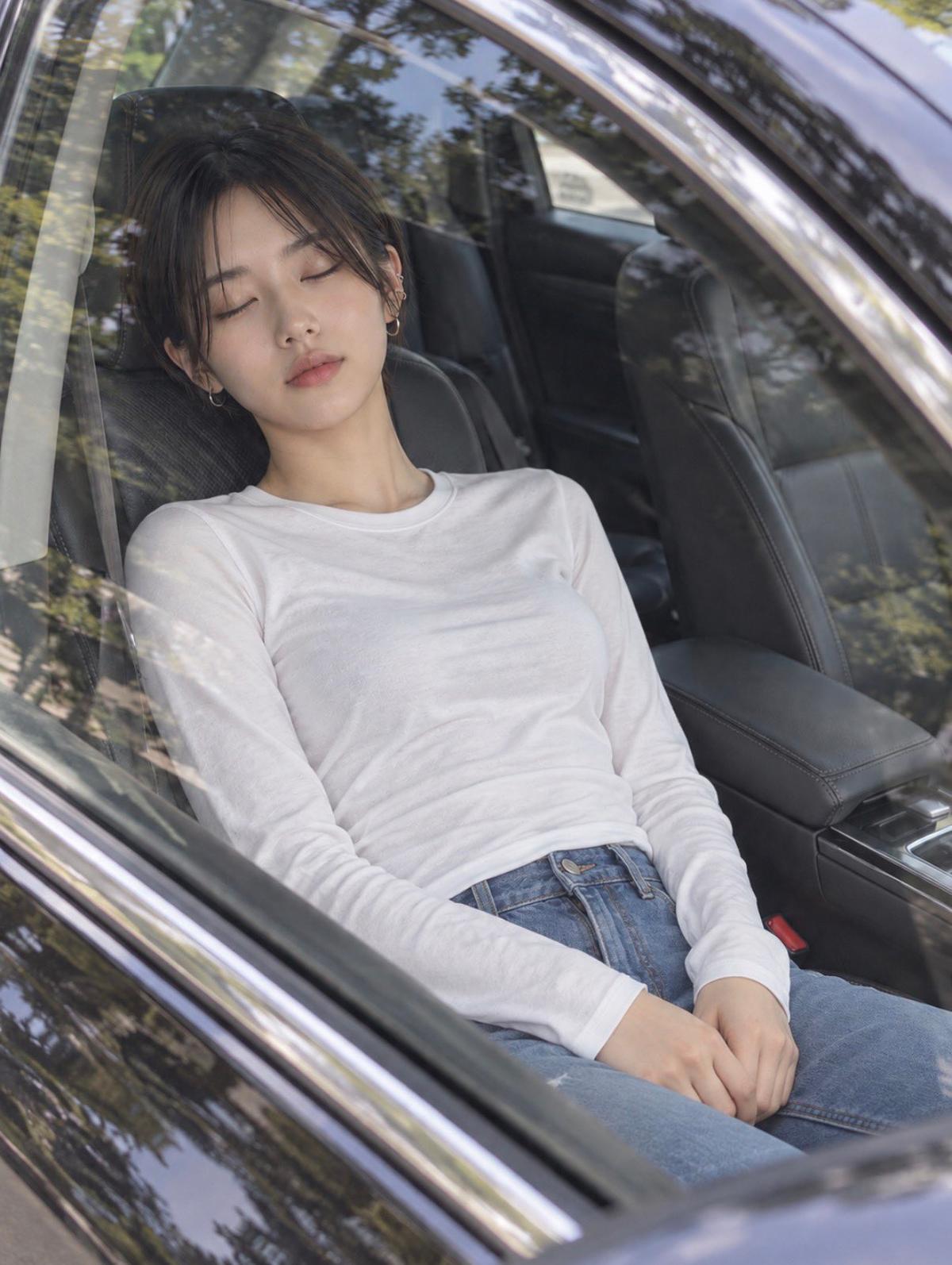 Dozing in the Driver's Seat, Seen Through the Car Window
