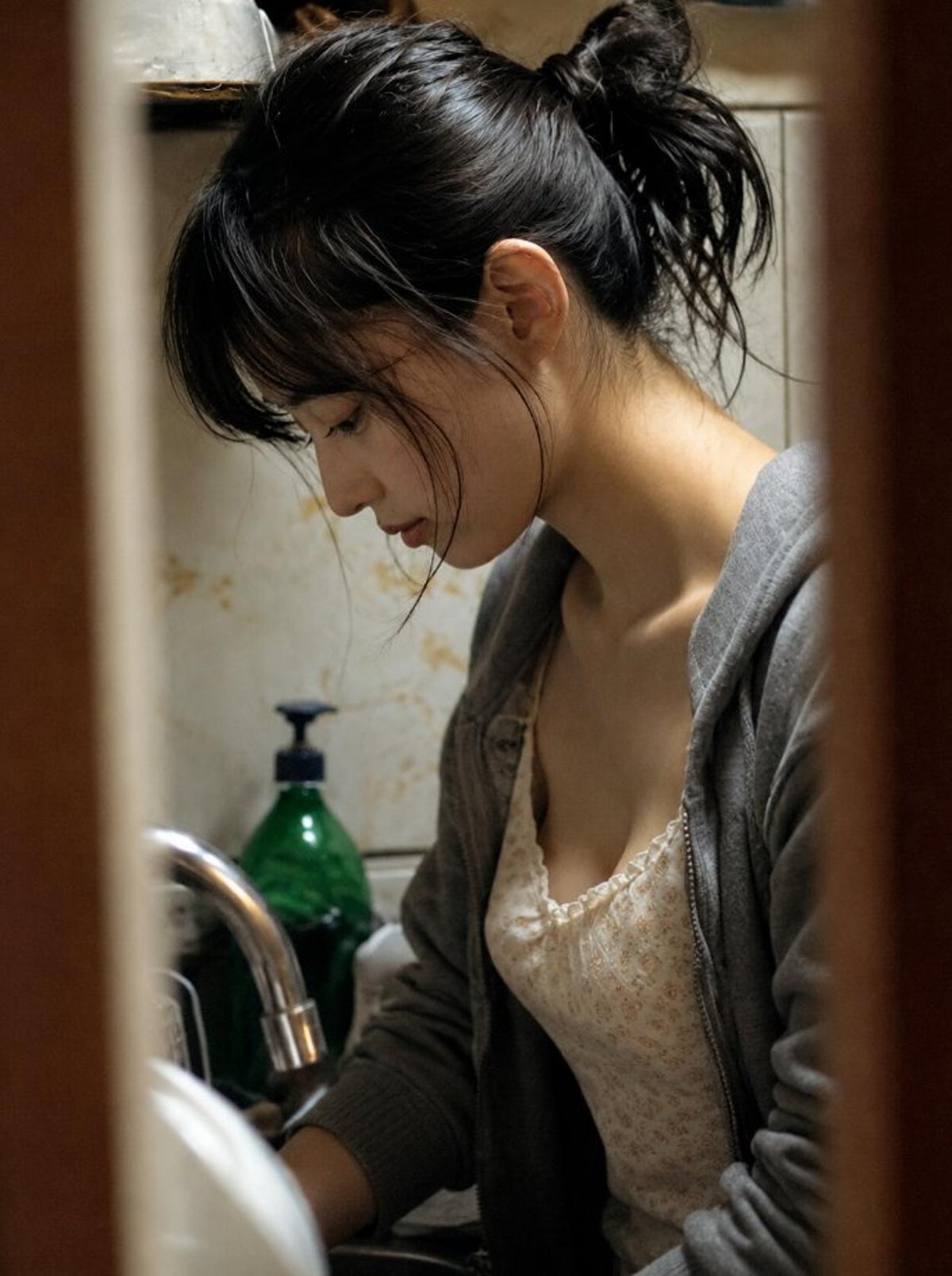 Candid kitchen portrait framed by a wooden doorway