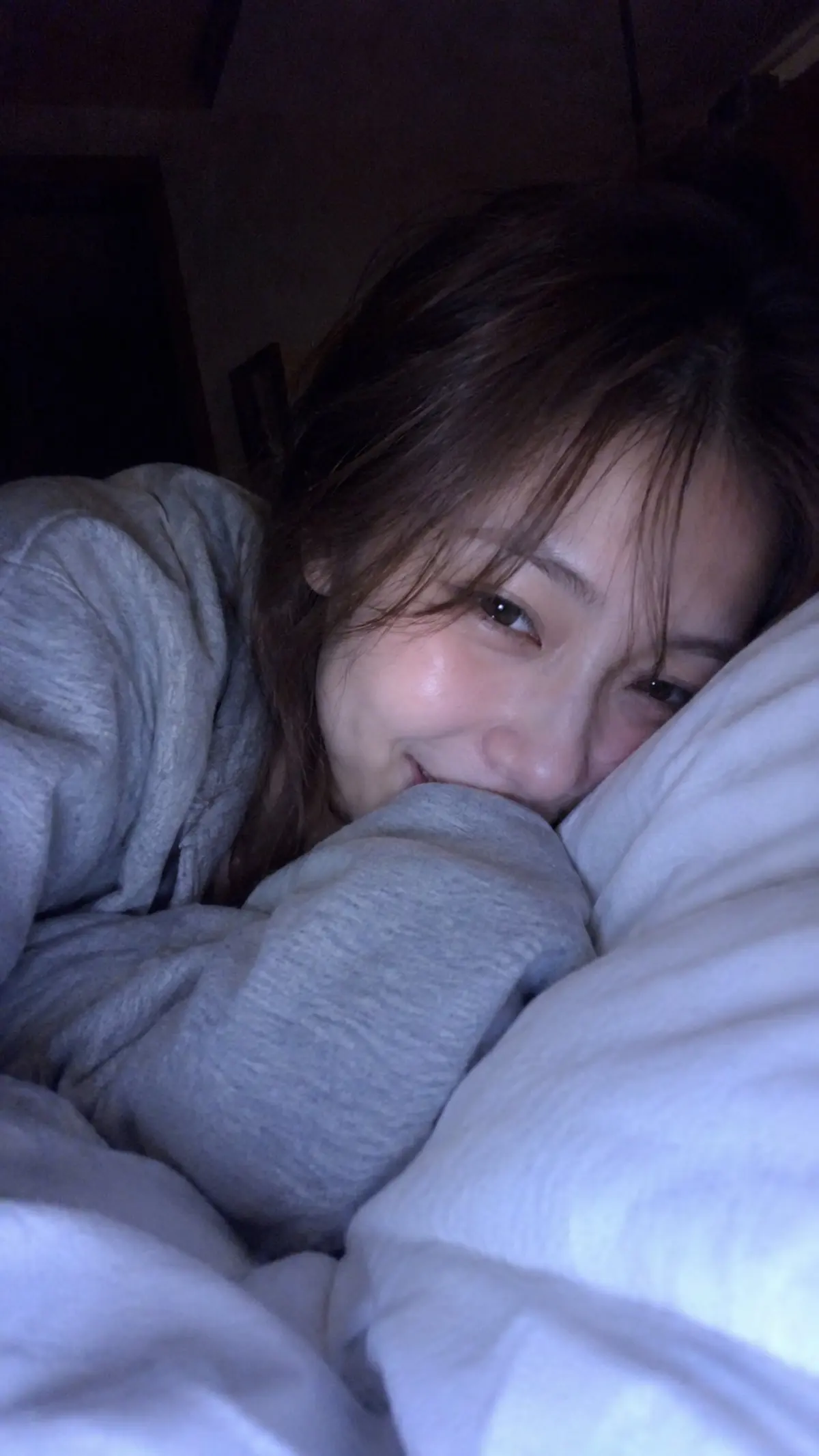 Late-Night Video Call Portrait in a Gray Sweatshirt