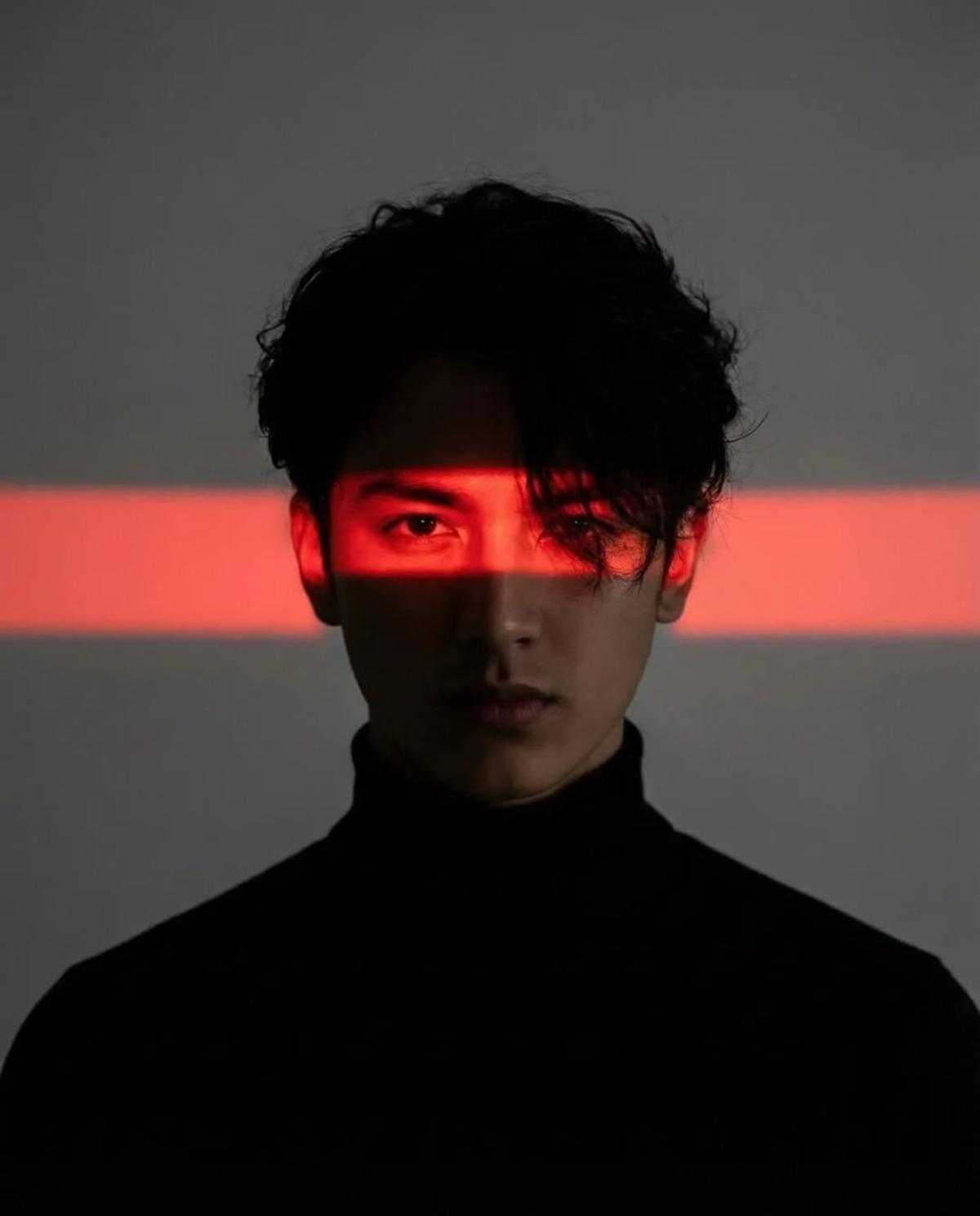 Cinematic studio portrait of a young man with messy textured