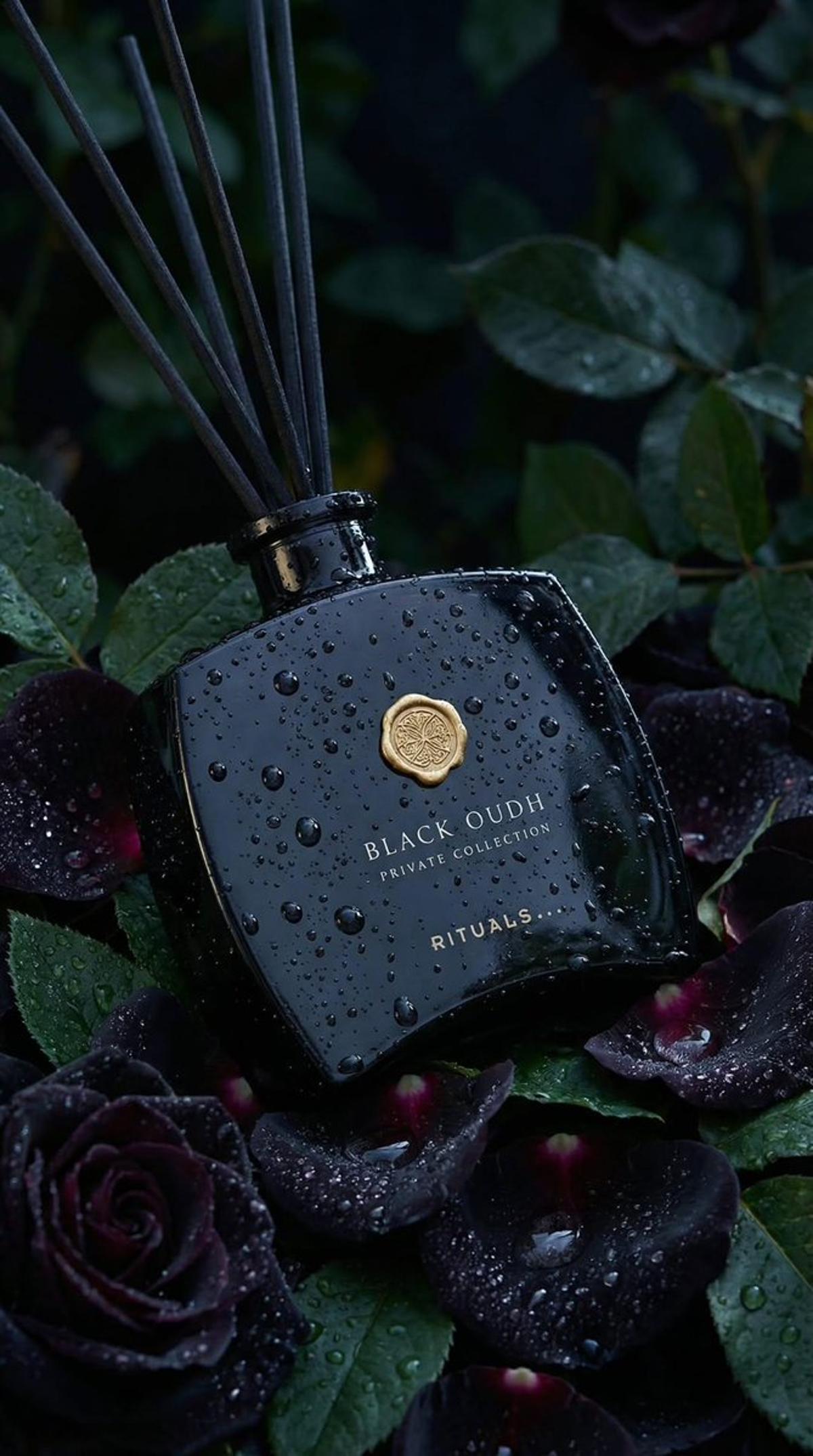 Ultra-realistic luxury product photography of a black glass 