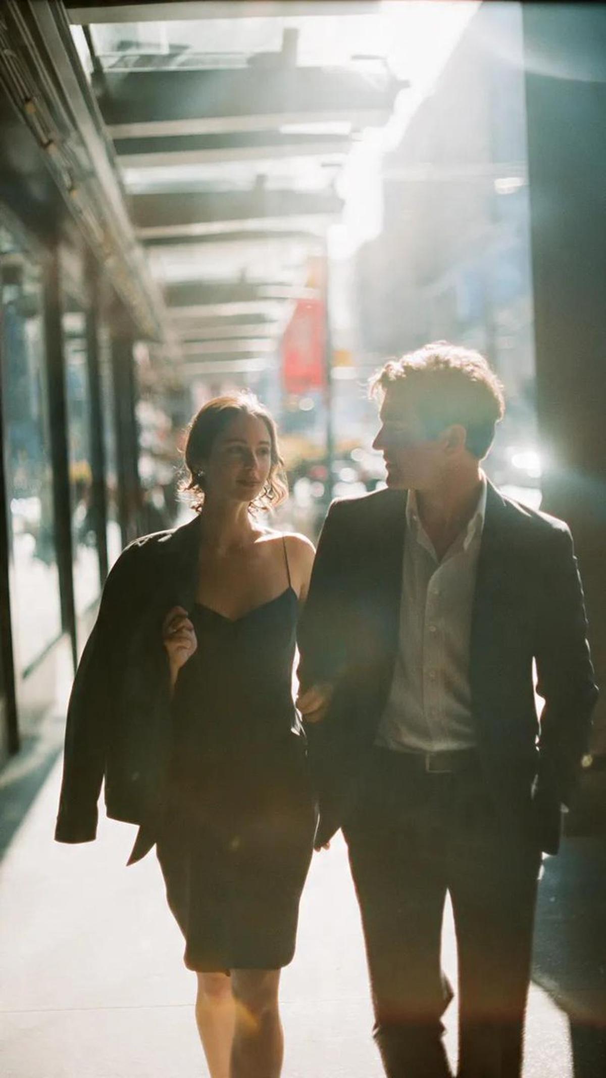 A cinematic candid medium shot portrait of a man and a woman