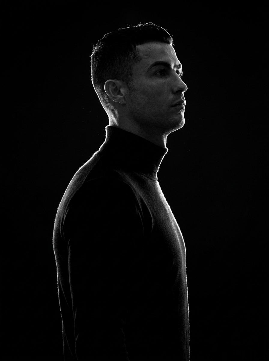 A minimalist black and white cinematic portrait featuring tw