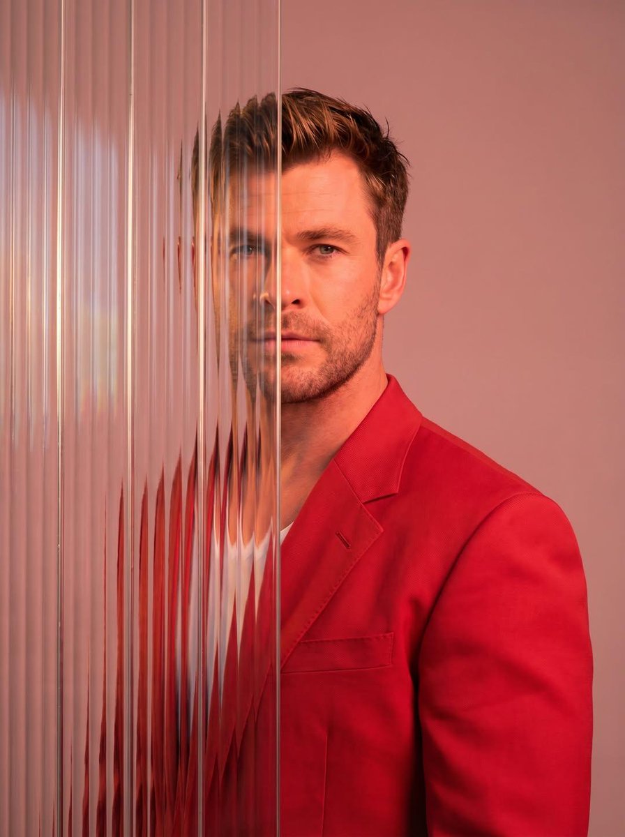 A striking editorial portrait photograph of a person wearing