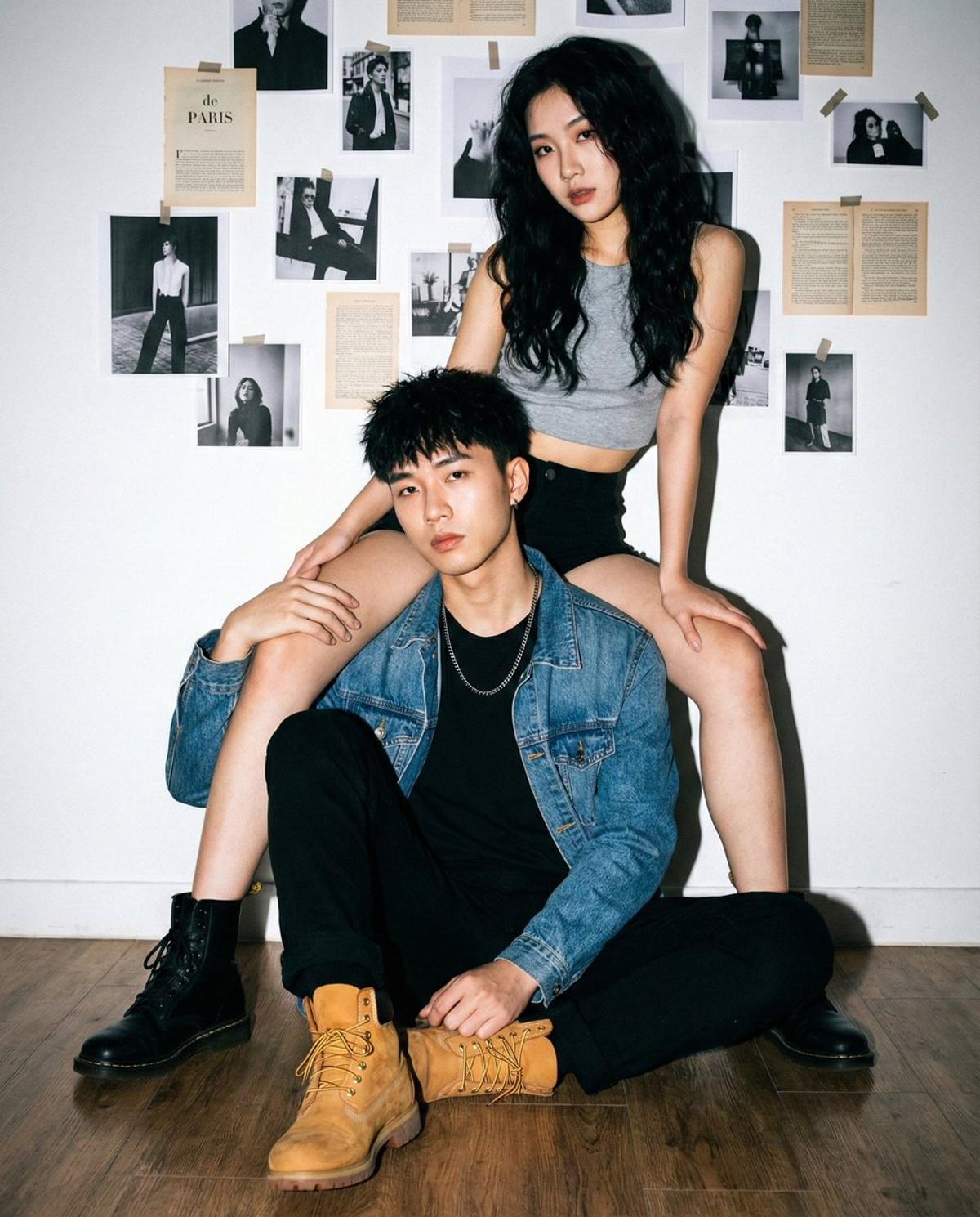 "Young Asian couple, cool/edgy fashion models.",
"fema
